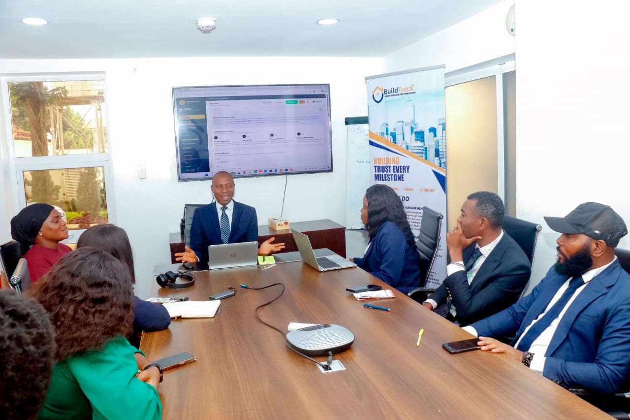 The BuildTrack team in a boardroom meeting in Abuja